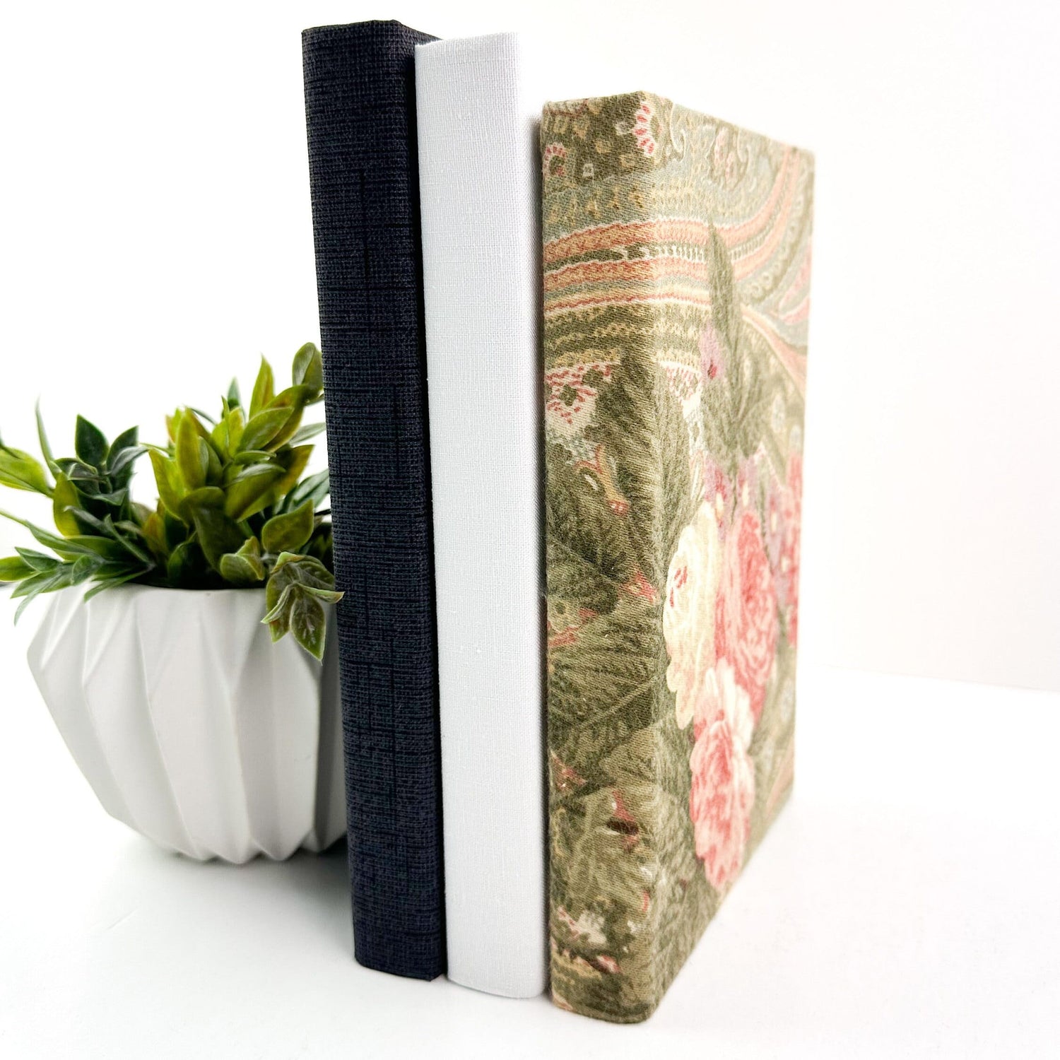 Fabric covered books for home decor.